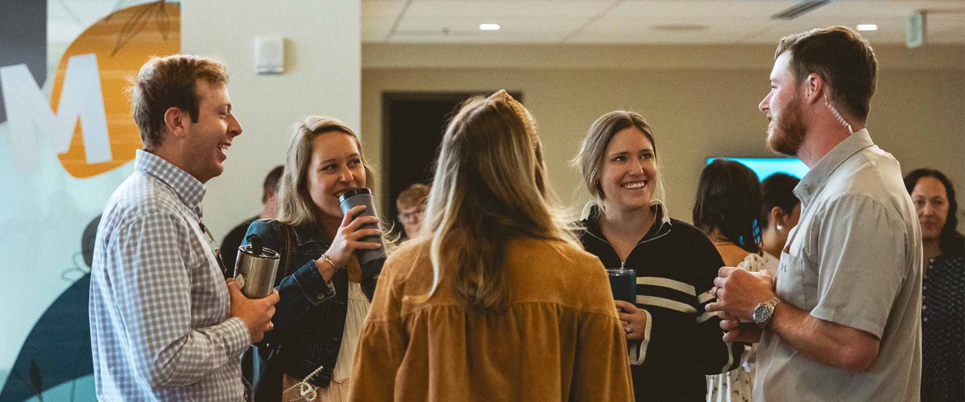 People talking in the Mission Hills church lobby