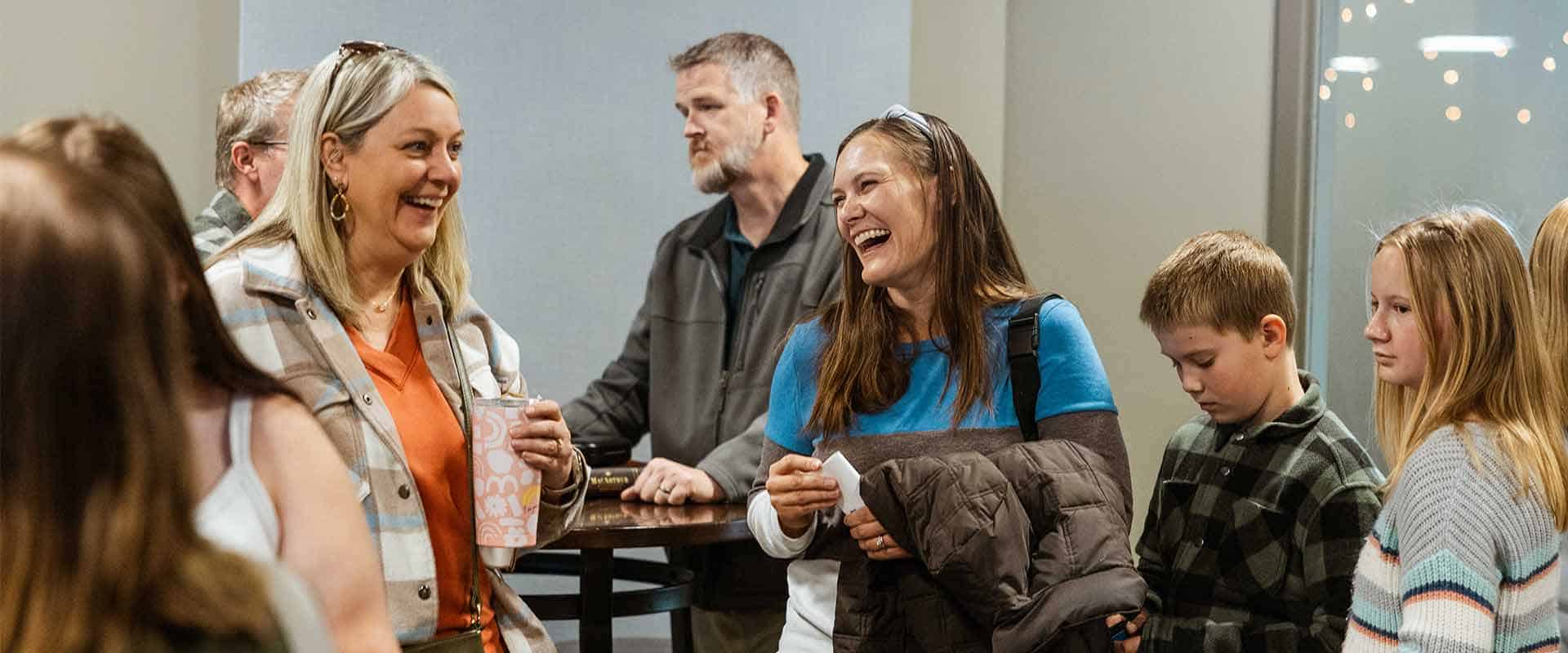 women laughing together at mission hills church